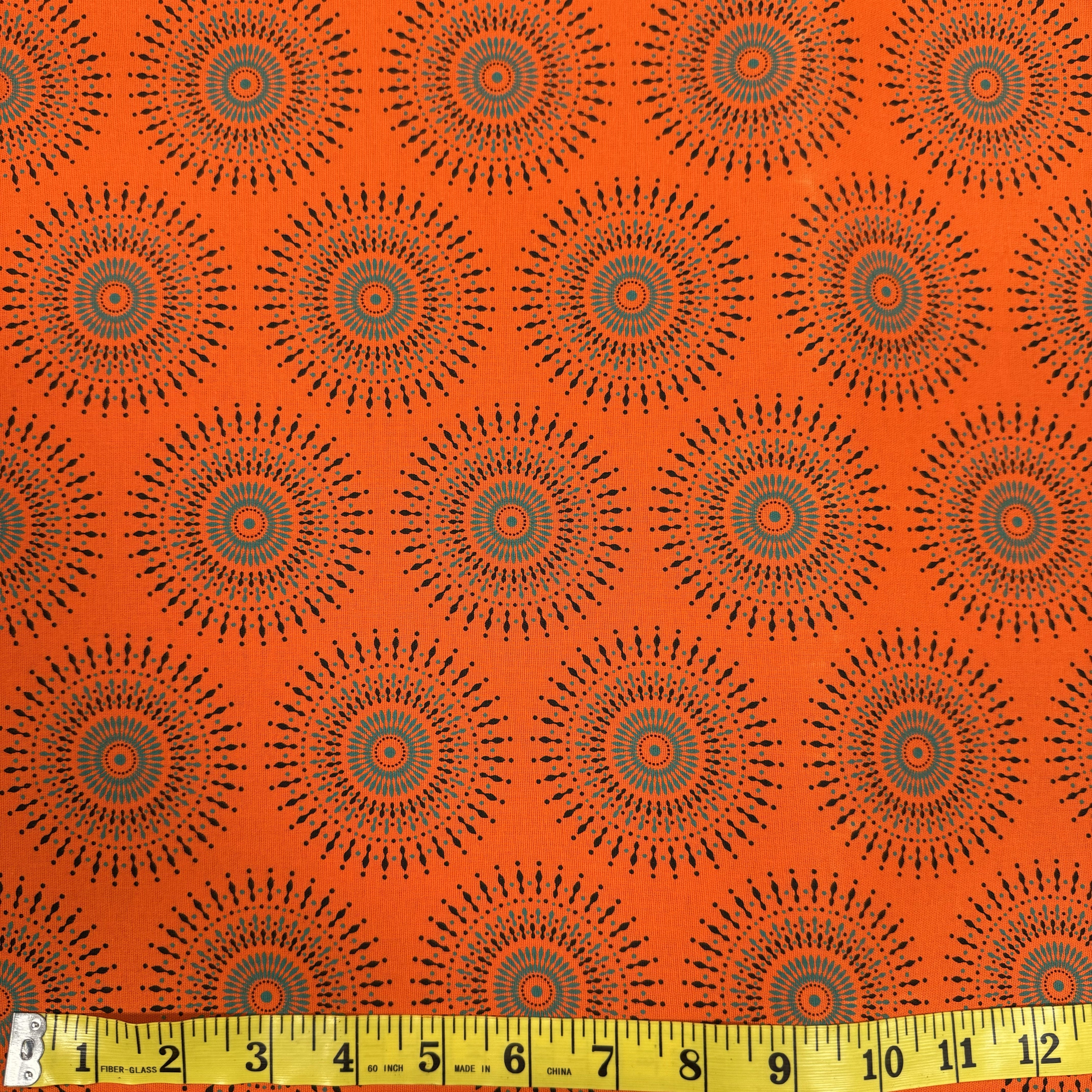 Bright Orange Radiating Circle Fabric – Bold Geometric Design, Cotton