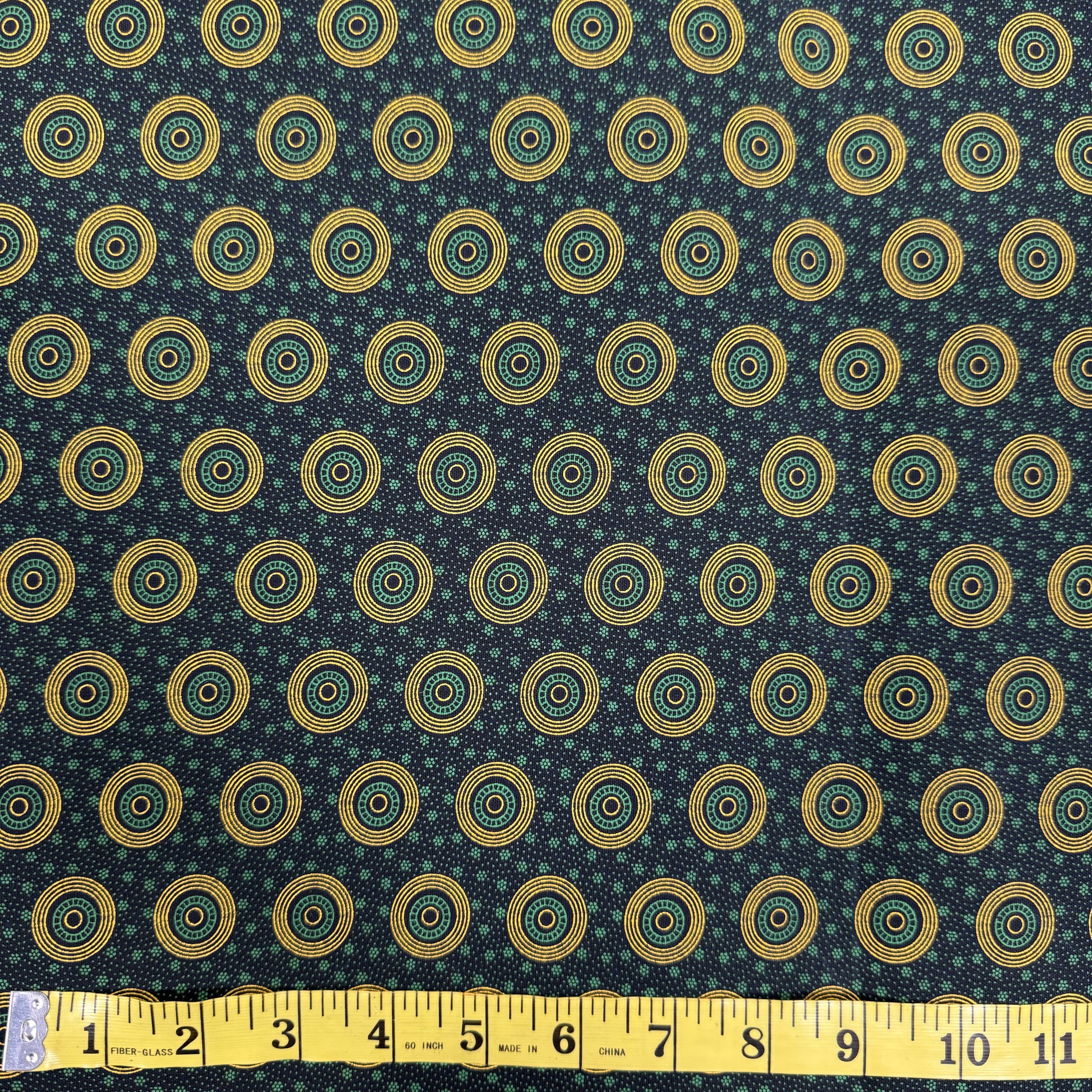 Elegant Green and Gold Circular Pattern Fabric – Geometric Cotton Design